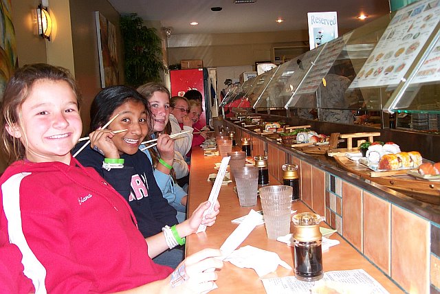 eating at the sushi restaurant